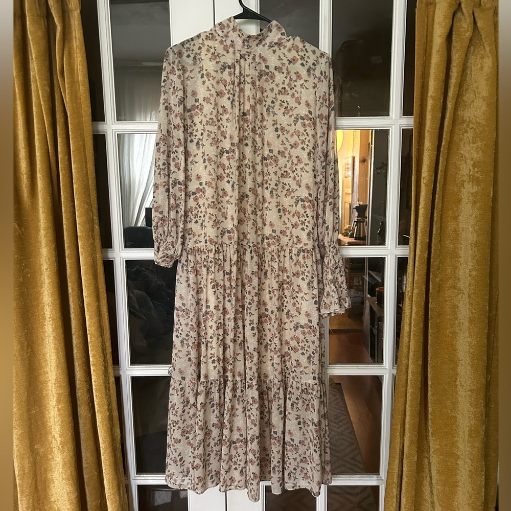Floral prairie dress. Elegant high neck with pretty floral pattern.